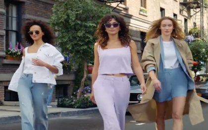 Stylish women strolling in urban setting.