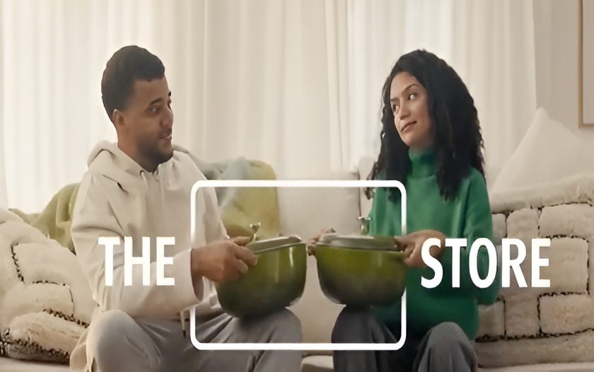 Sitting couple holding matching cookware