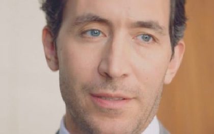 Close-up of a man with light eyes