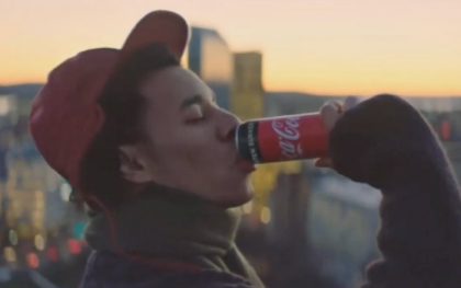 Man enjoying beverage in cityscape setting