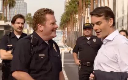 Police officers talking on a sunny street