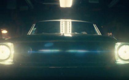 Classic car with headlights on