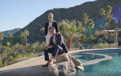 Stylish duo posing by the pool